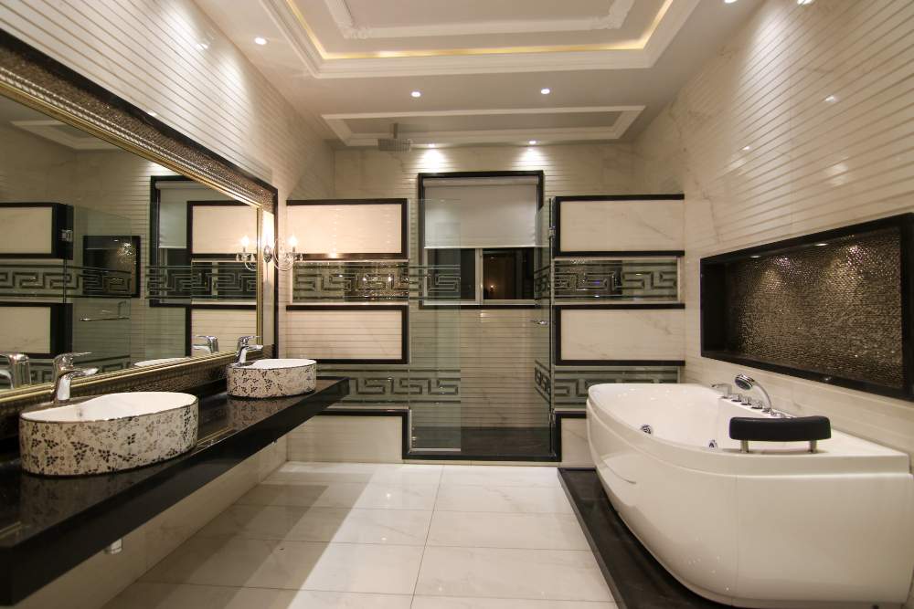 Elegant modern bathroom with double sinks and tub.